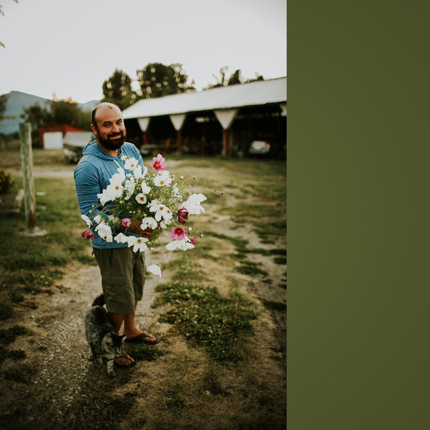 Mike holding an armful of cosmos